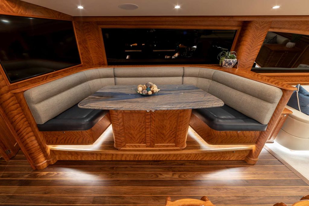 Interior seating in a dinette area of a Jarrett Bay Boatworks sport fishing boat.