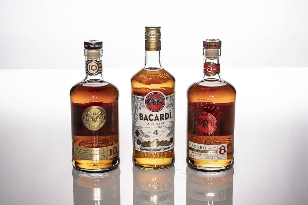 three bottles of bacardi rum