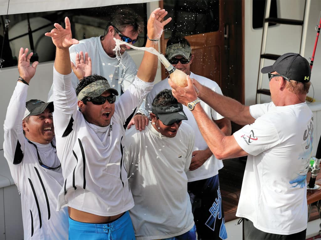 A fishing team celebrating after a tournament win.