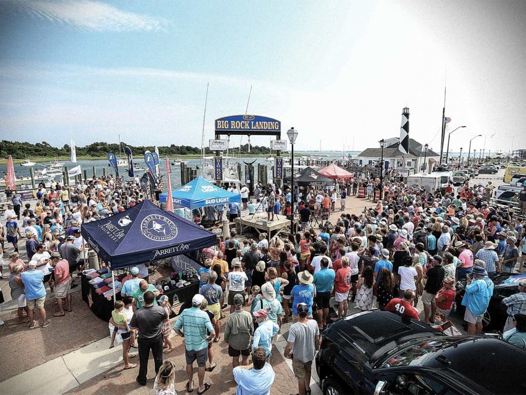 a group gathering at the big rock landing blue marlin tournament