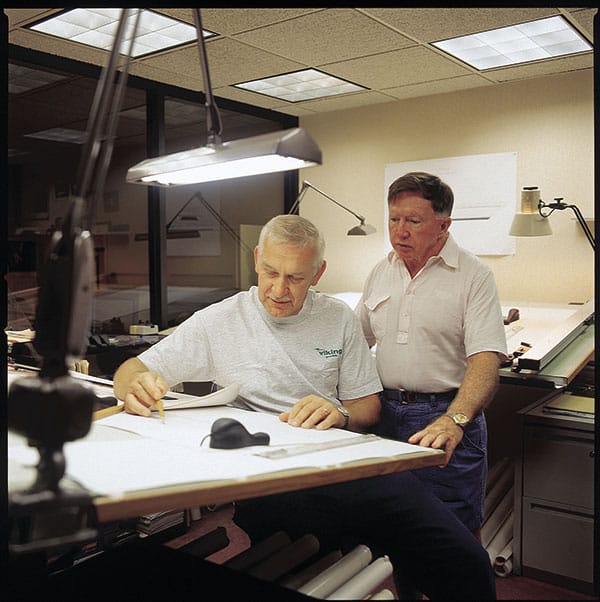 Bill Healey with Rudy Dalinger, a production engineer at Viking Yachts.