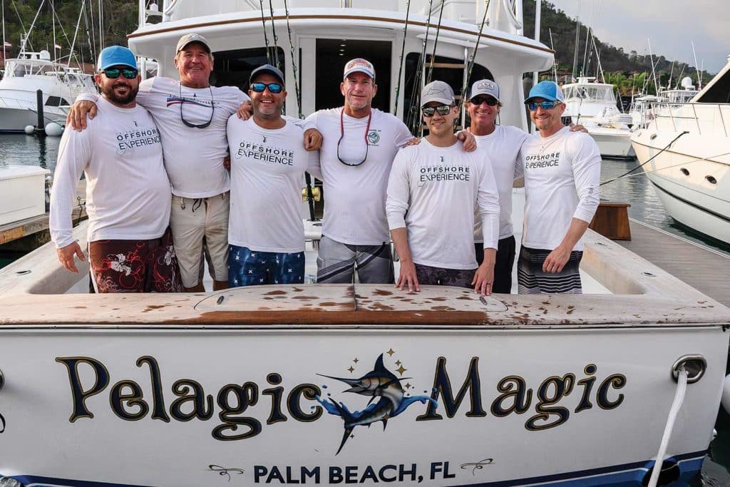 pelagic magic team standing on a boat deck