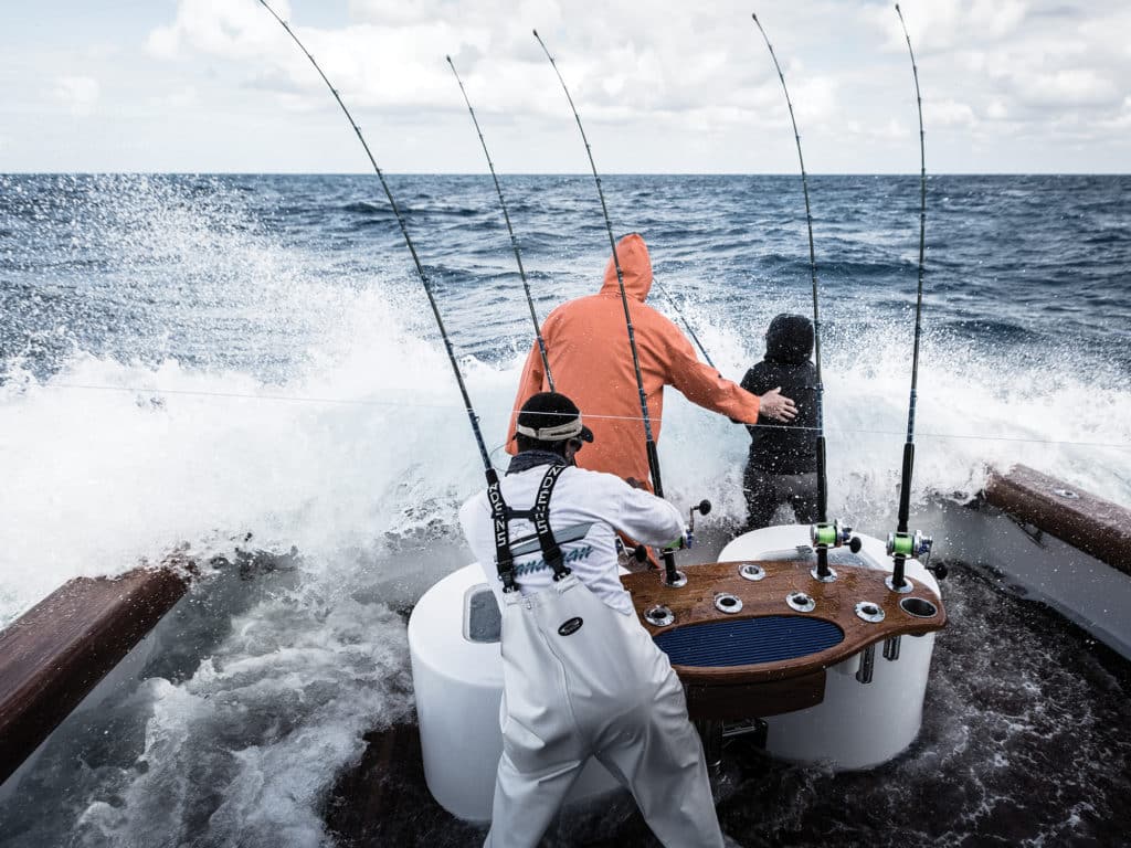 fighting a sailfish in rough conditions from a sport-fisher