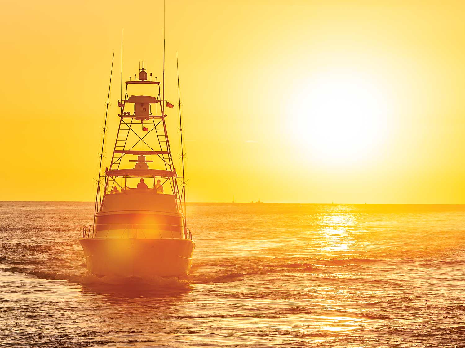 https://www.marlinmag.com/wp-content/uploads/2023/03/sport-fishing-boat-sunset-skin-care.jpg