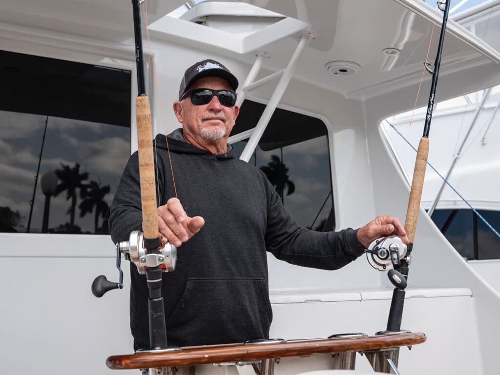 Tony Huerta standing in the cockpit of a sport-fishing boat.