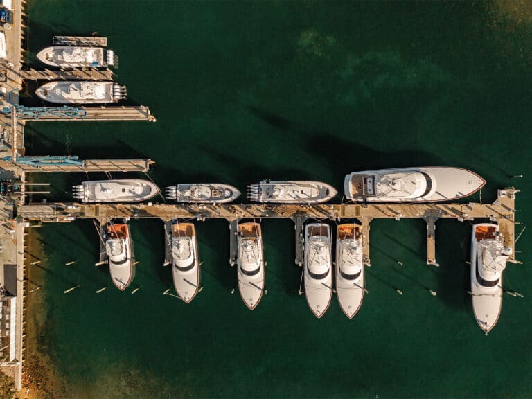 Aerial view of sport-fishing boats docked in a marina.