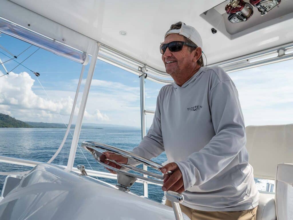 Capt. Bubba Carter at the helm of a sport-fishing boat.