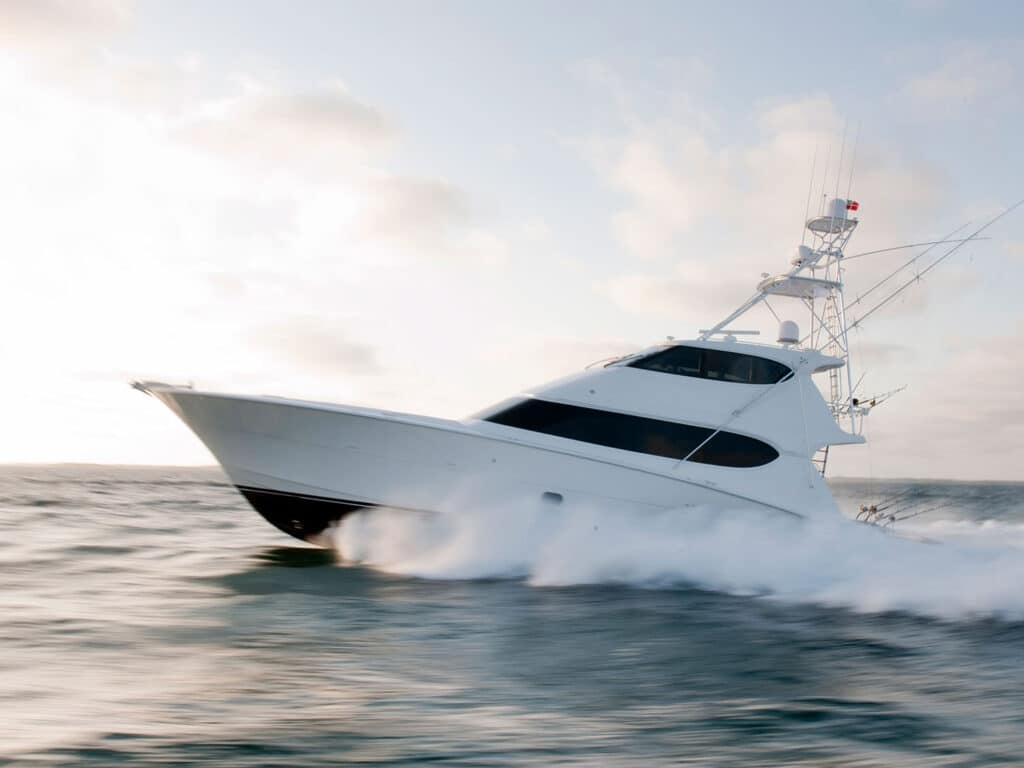 A sport-fishing boat cruises across the water.