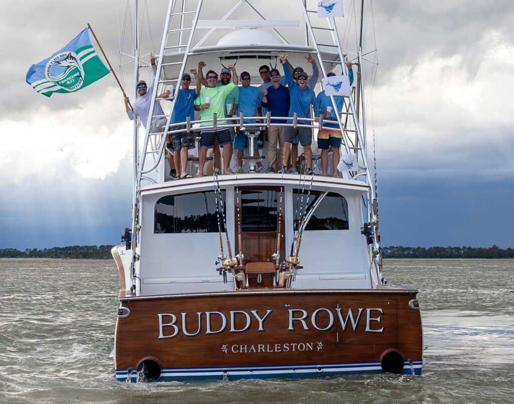 A group of anglers stand in the tower of a sport-fishing boat named Buddy Rowe.