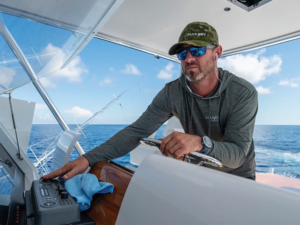 A sport-fishing angler captain at the helm