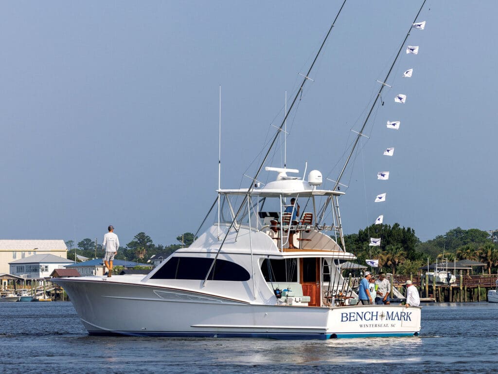 A sport-fishing boat cruises on the open water.