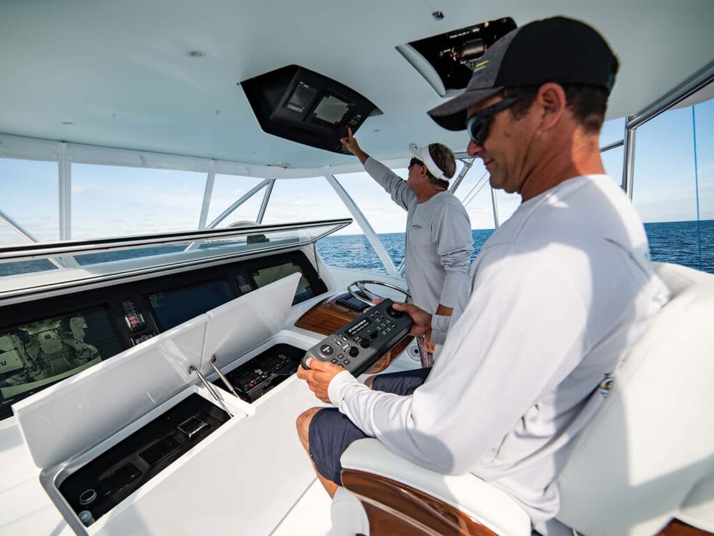 Boat captain and crew at the helm of a sport-fishing boat.