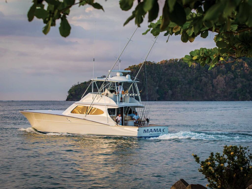 A sport-fishing boat cruises across the water.