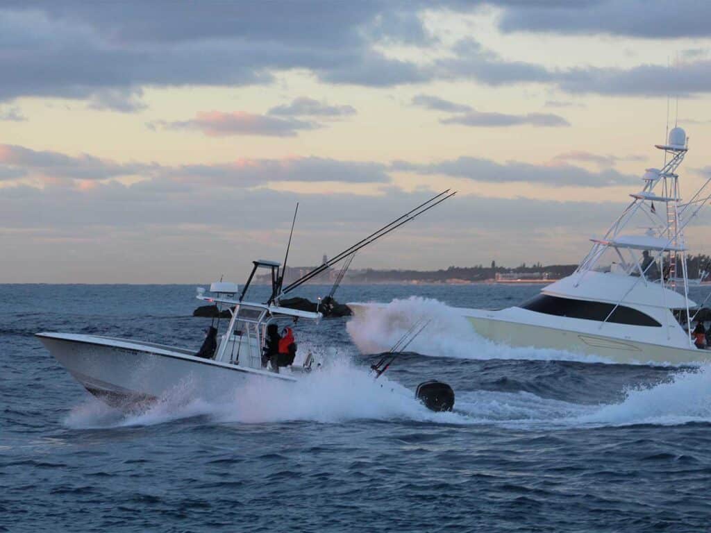 Two sport-fishing boats cruise across the open waters.