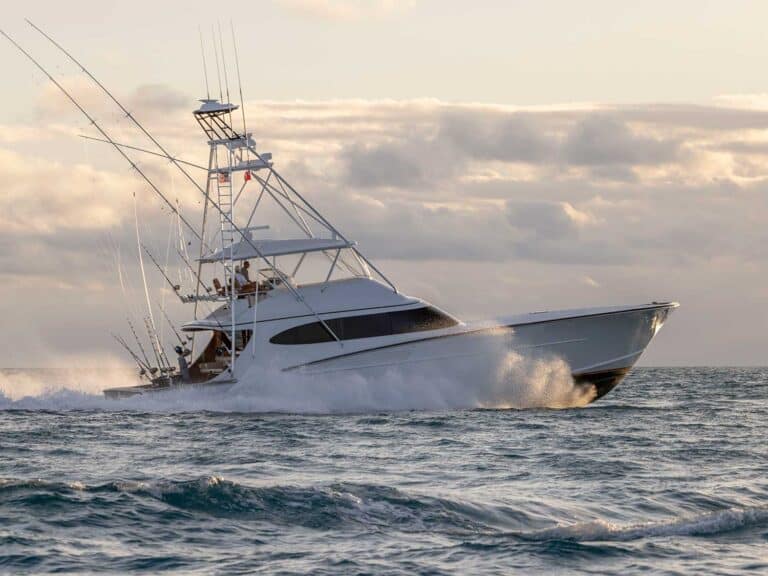 A sport-fishing boat cruises across the open ocean.