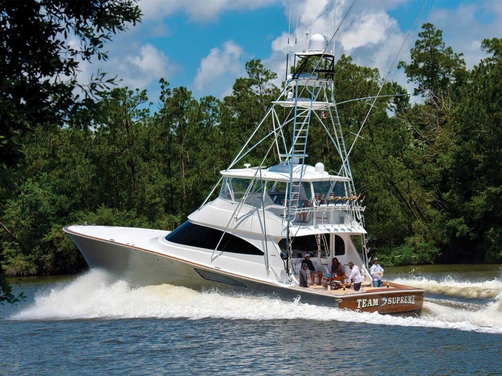 A sport-fishing boat cruises across the water.