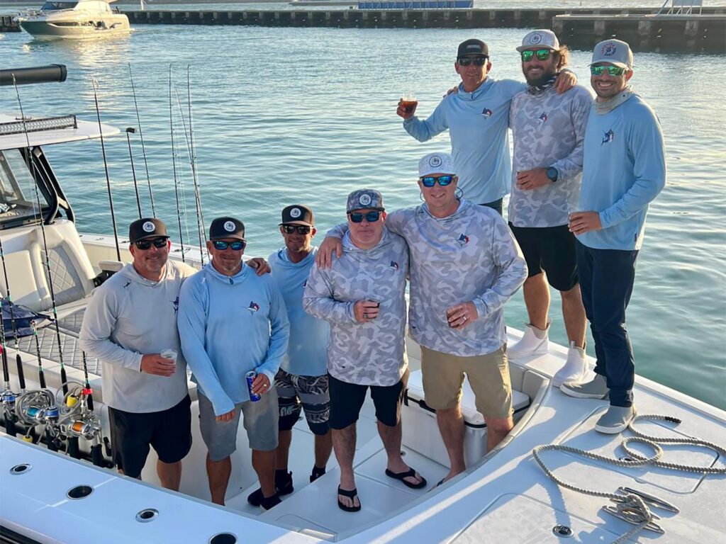 A sport-fishing team celebrating.