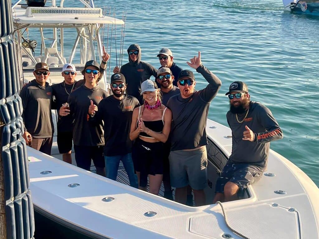 A sport-fishing team celebrating.