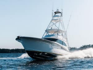 A Jarrett Bay Boatworks sport-fishing boat cruising across the water.