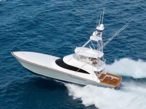 A new Viking 74 sport-fishing boat cruises across the water.