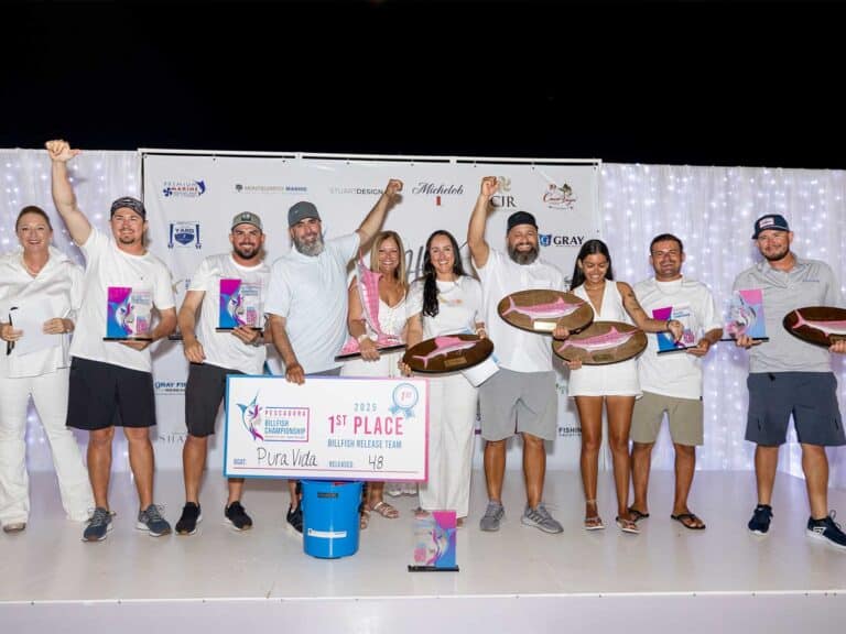 A sport-fishing team celebrates on stage at the 2025 Pescadora Billfish Championship awards ceremony.